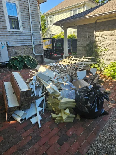 Lattice fencing and wood scraps removed from a renovation project near Barnstable
