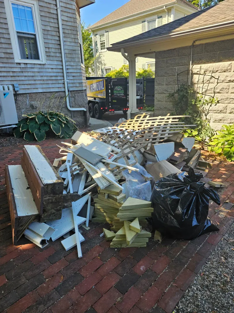 Lattice fencing and wood scraps removed from a renovation project near Barnstable
