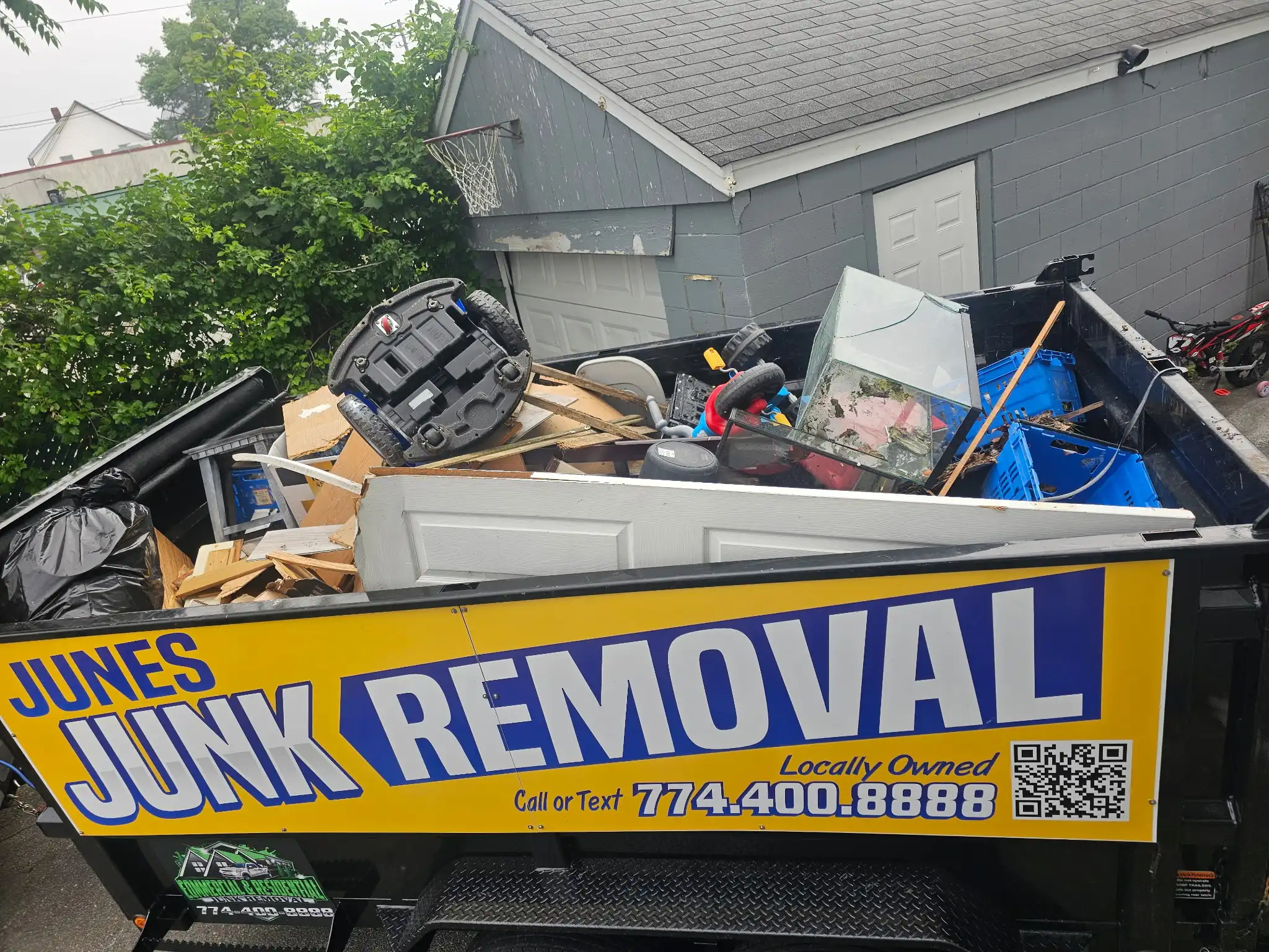 Fully loaded dump trailer with construction debris