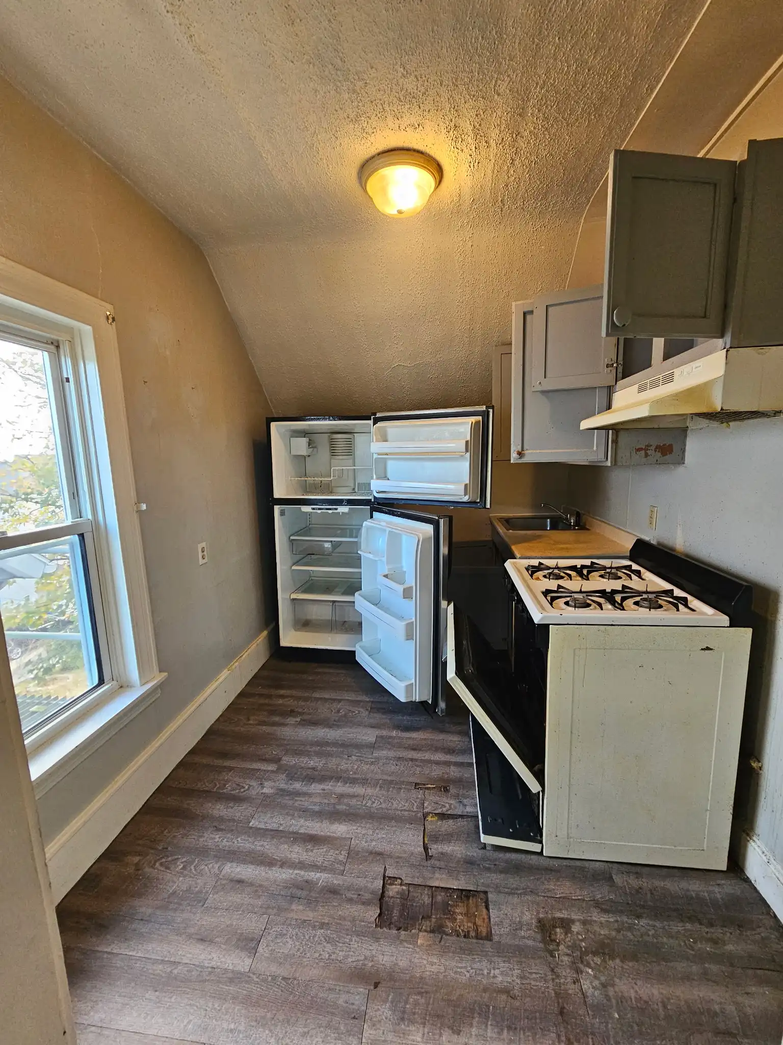 Clearing out an old fridge and stove from a South Coast property