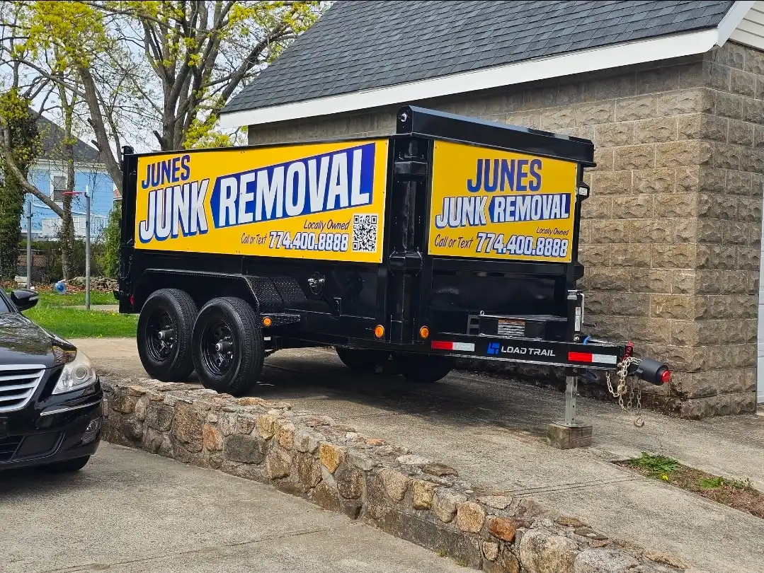 June's Junk Removal branded dump trailer in New Bedford MA